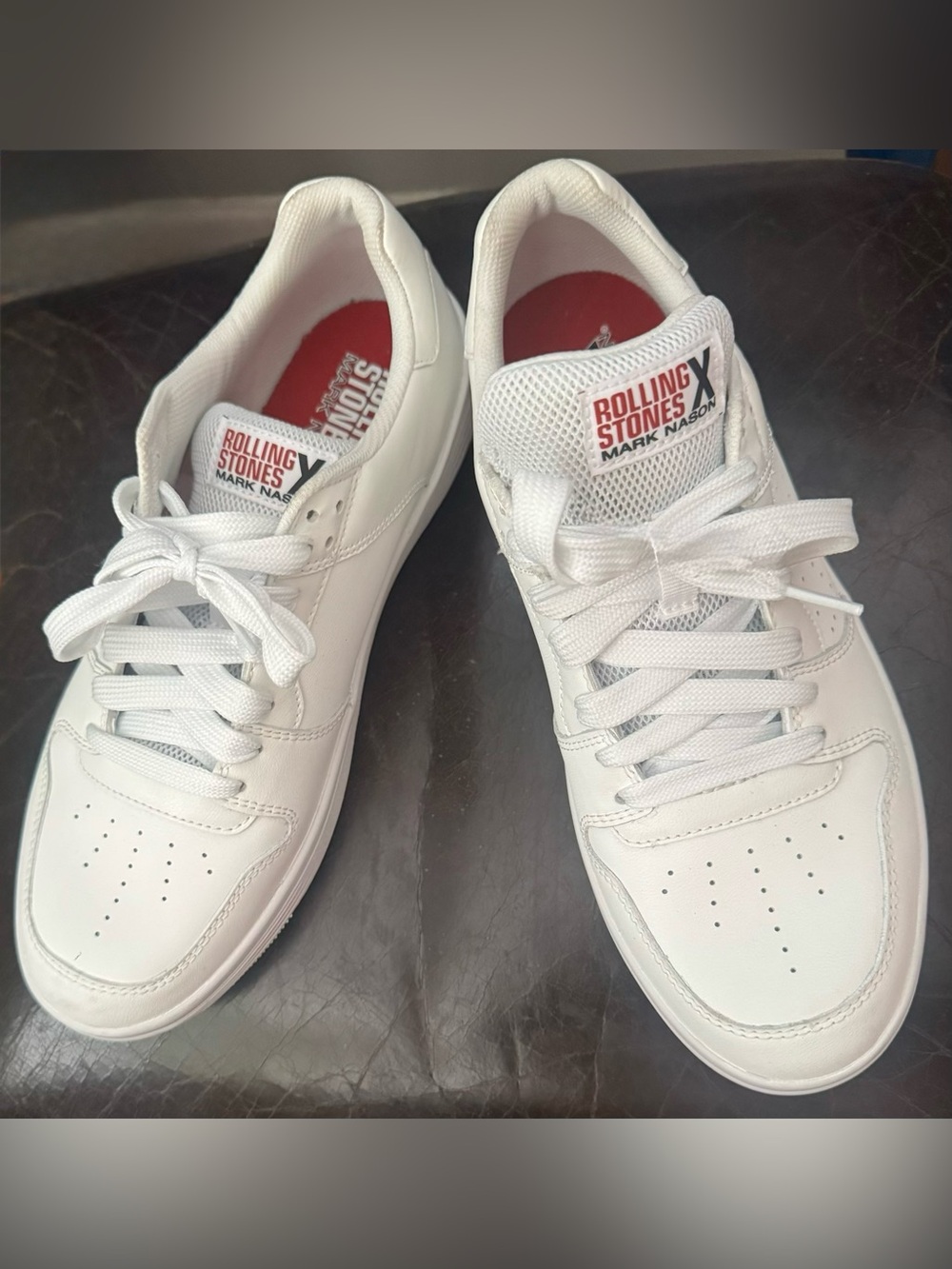 This is a pair of white Mark Nason x Skechers Rolling Stones Tennis Shoe
